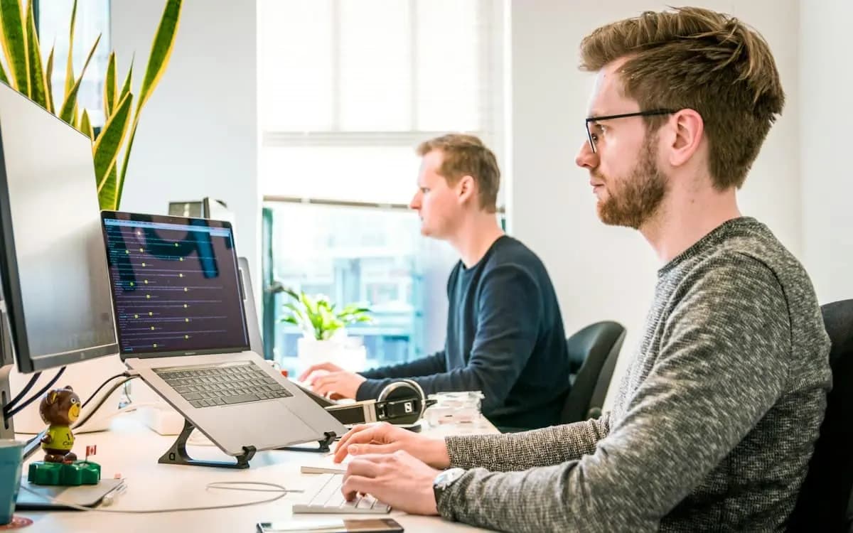 Operations team collaborating on CRM workflows connecting VICIdial to GoHighLevel
